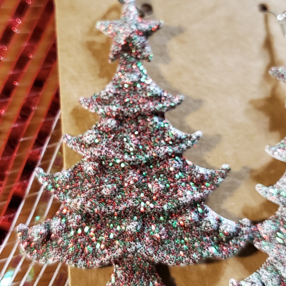 Glittering sparkly Christmas. A pair of red and glittered Christmas Tree.